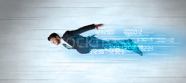 Businessman flying super fast with data numbers left behind Stock photo © ra2studio