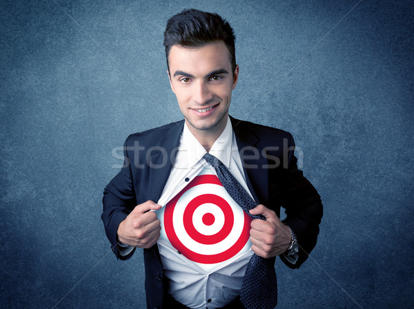 Businessman tearing shirt with target sign on his chest Stock photo © ra2studio