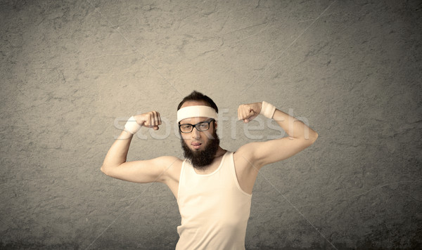 Young male showing muscles Stock photo © ra2studio