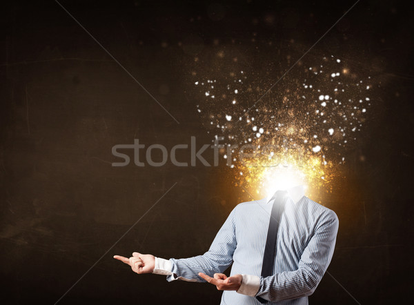 Business man with glowing exploding head Stock photo © ra2studio