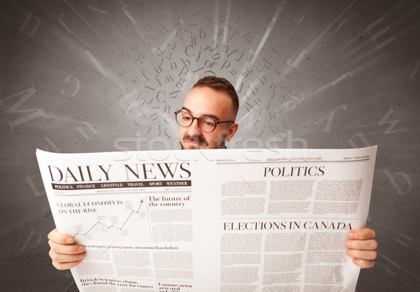 Businessman reading newspaper Stock photo © ra2studio