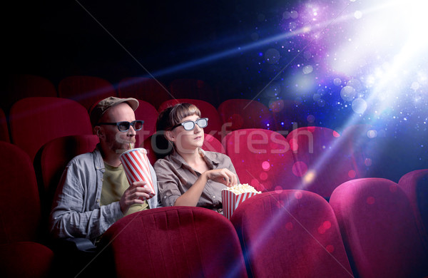 Romantic couple sitting at spectacle Stock photo © ra2studio
