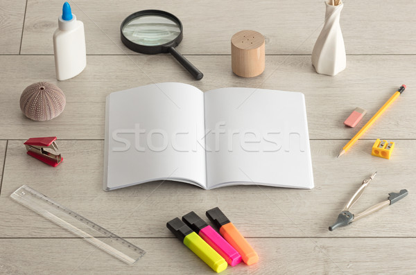 Notebook on the floor with office tools nearby Stock photo © ra2studio