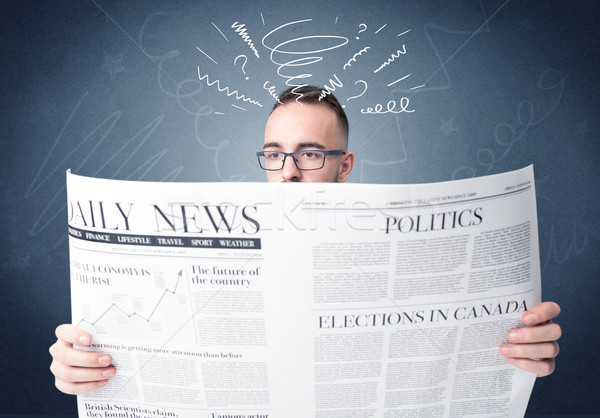 Stock photo: Businessman reading newspaper