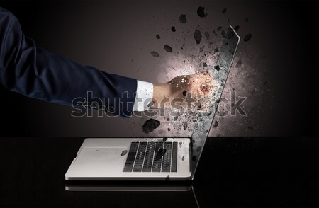 Hand coming out of a laptop Stock photo © ra2studio