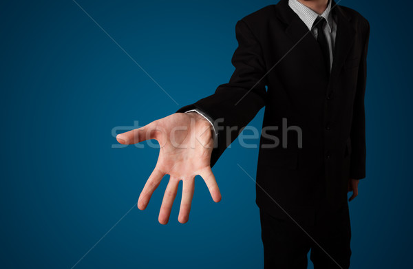 Businessman pressing imaginary button Stock photo © ra2studio