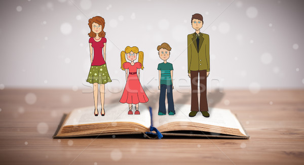 Drawing of a happy family on opened book Stock photo © ra2studio