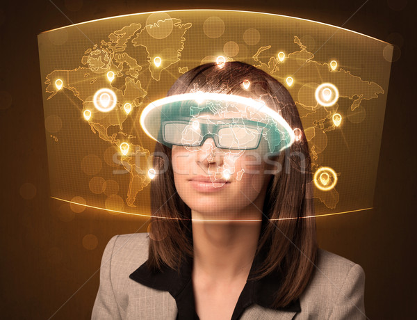 Jeune femme regarder futuriste réseau social carte ordinateur [[stock_photo]] © ra2studio