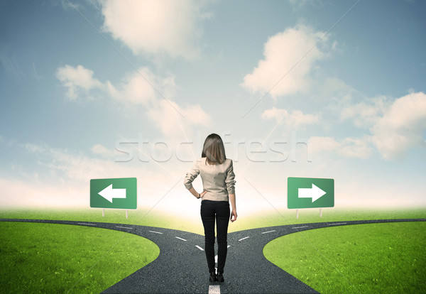 Businesswoman in front of a choice Stock photo © ra2studio