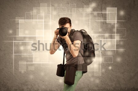 Male holdig professional camera with lens Stock photo © ra2studio