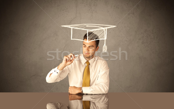 Happy college graduate drawing academic hat Stock photo © ra2studio