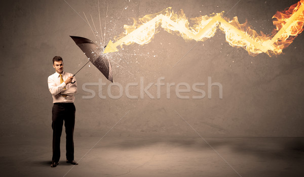 Uomo d'affari fuoco arrow ombrello lavoro Foto d'archivio © ra2studio