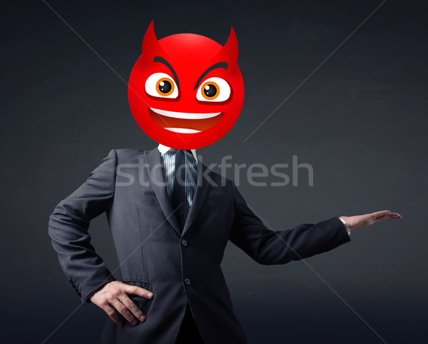 businessman wears devil smiley face Stock photo © ra2studio