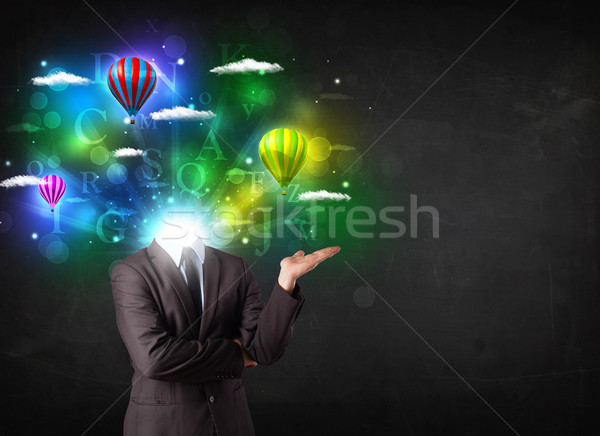 Man in suit with dreamy cloudscape concept Stock photo © ra2studio