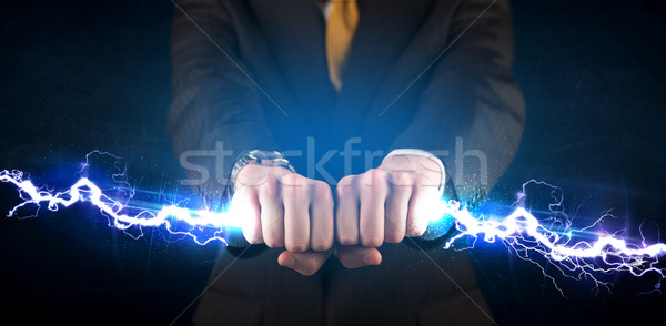 Homme d'affaires électricité lumière mains [[stock_photo]] © ra2studio