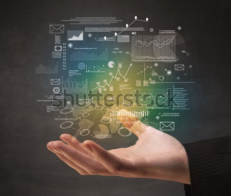 Woman drawing business scheme and icons on whiteboard Stock photo © ra2studio