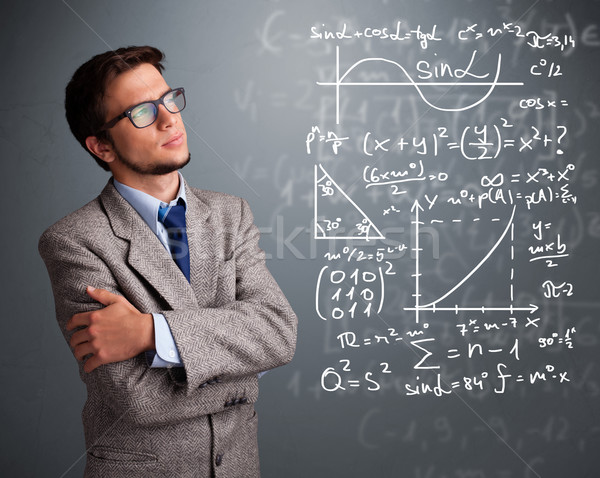 Handsome school boy thinking about complex mathematical signs Stock photo © ra2studio