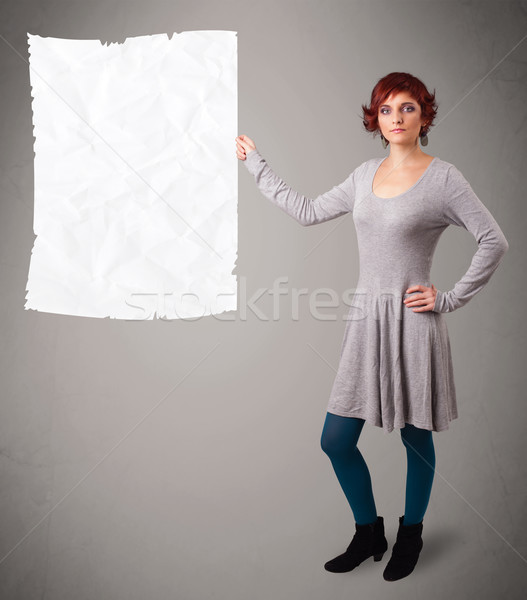 Young girl holding crumpled white paper copy space Stock photo © ra2studio