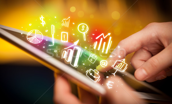 Hand touching tablet pc, charts concept Stock photo © ra2studio