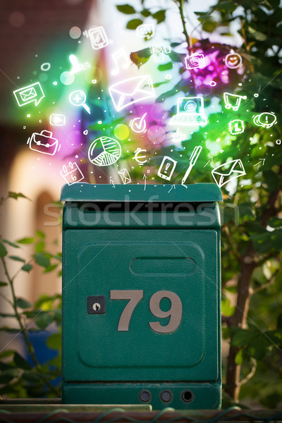 Stock photo: Colorful icons and symbols bursting out of a mailbox