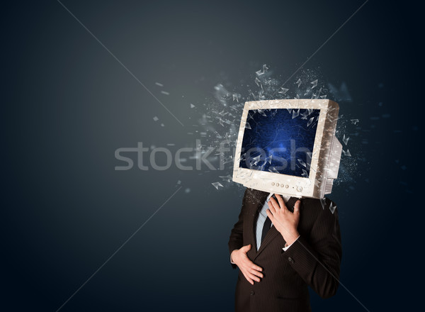 Stock photo: Computer monitor screen exploding on a young persons head 