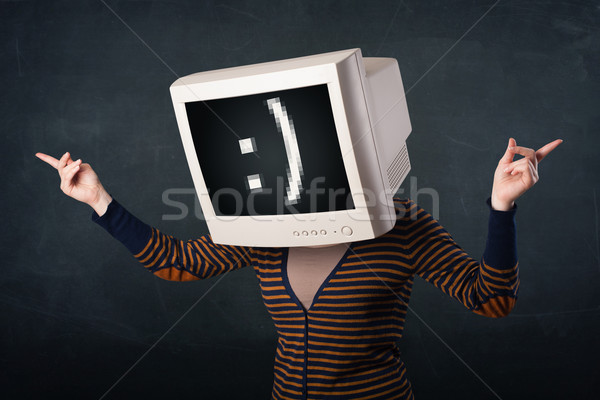 Funny girl with a monitor box on her head and a smiley face  Stock photo © ra2studio