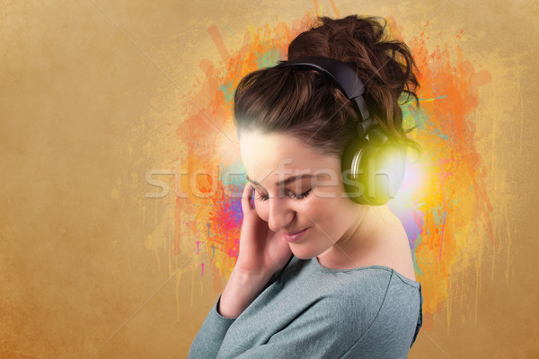 Young woman with headphones listening to music Stock photo © ra2studio