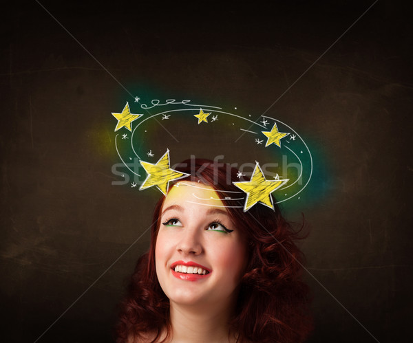 girl with yellow stars circleing around her head illustration Stock photo © ra2studio