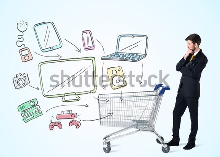 Businessman with shopping cart Stock photo © ra2studio