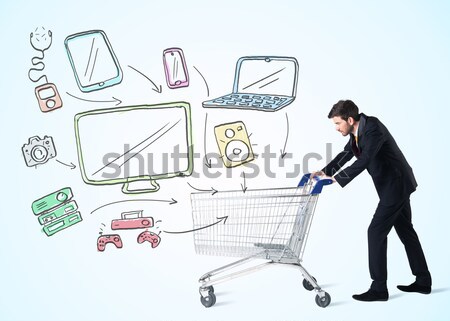 Businessman with shopping cart Stock photo © ra2studio
