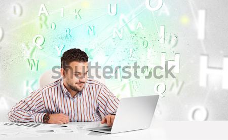 Business man at desk with green word cloud Stock photo © ra2studio