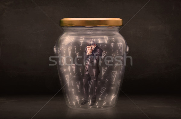 Business man trapped in jar with exclamation marks concept Stock photo © ra2studio