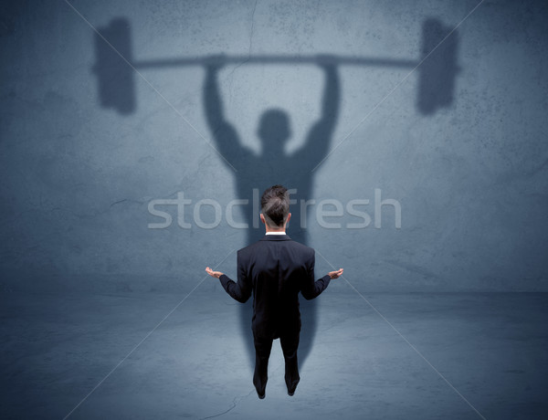 Geschäftsmann Gewichtheben Schatten jungen eleganten Verkäufer Stock foto © ra2studio