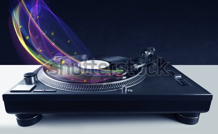 Turntable playing vinyl with glowing abstract lines Stock photo © ra2studio