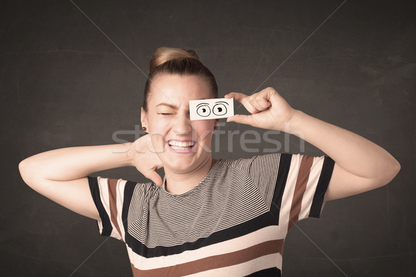 Funny woman looking with hand drawn paper eyes Stock photo © ra2studio