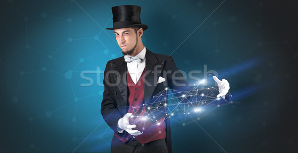 Magician with geometrical connection on his hand  Stock photo © ra2studio