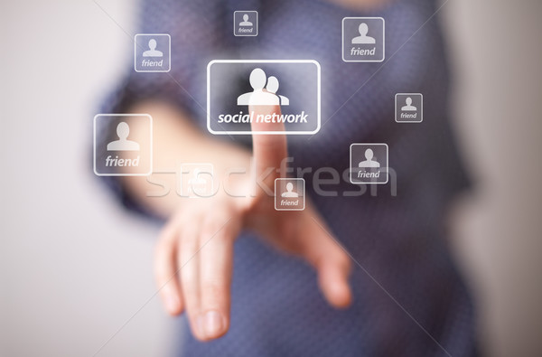 Stock photo: hand pressing Social network icon