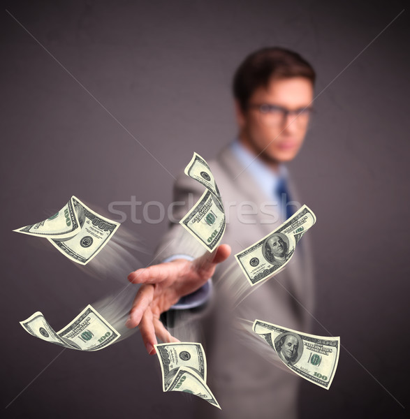 Stock photo: Young man throwing money