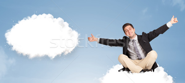 Handsome young man sitting on cloud and thinking of abstract speech bubble Stock photo © ra2studio