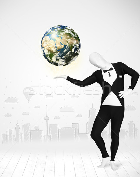 man in full body suit holding planet earth Stock photo © ra2studio