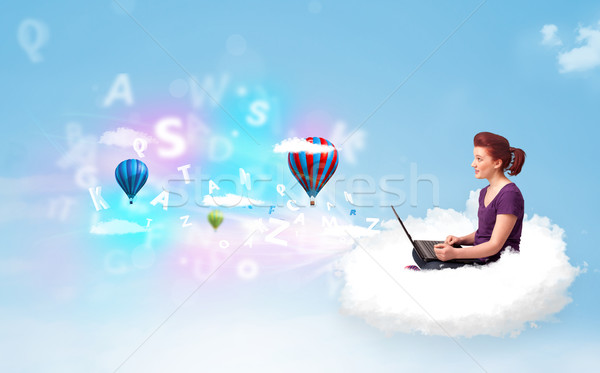 Young woman sitting in cloud with laptop Stock photo © ra2studio