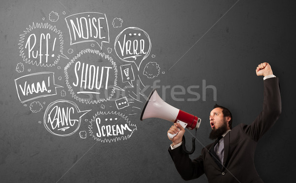 Guy in suit yelling into megaphone and hand drawn speech bubbles Stock photo © ra2studio