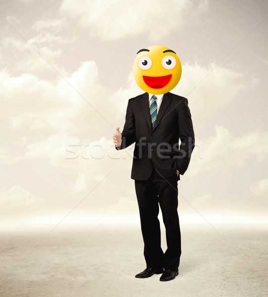 businessman wears yellow smiley face Stock photo © ra2studio