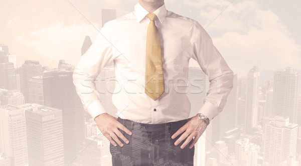 Handsome business man with overlay cityscape Stock photo © ra2studio