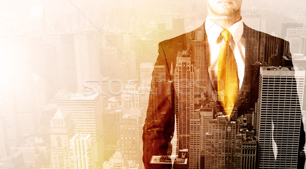 Business man looking at overlay city background Stock photo © ra2studio