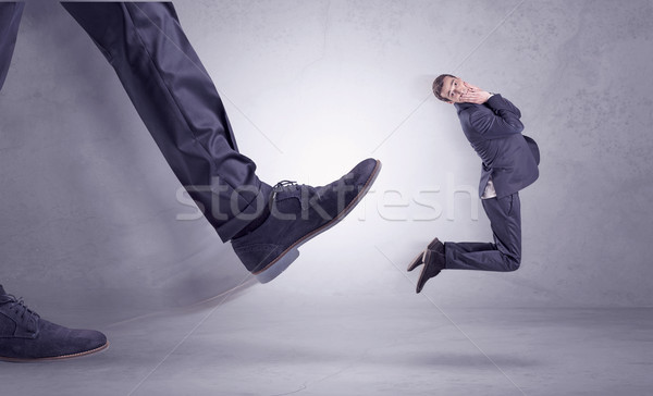 Foot kicking, businessman flying Stock photo © ra2studio