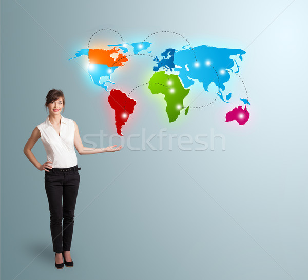 Young woman presenting colorful world map Stock photo © ra2studio