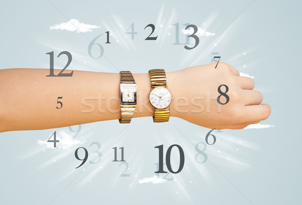 Hand with watch and numbers on the side comming out Stock photo © ra2studio