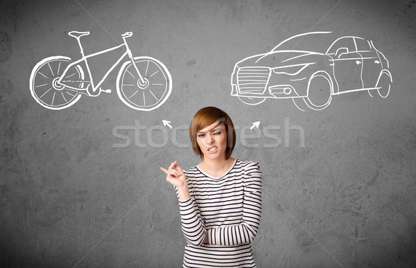 Woman making a choice between bicycle and car Stock photo © ra2studio
