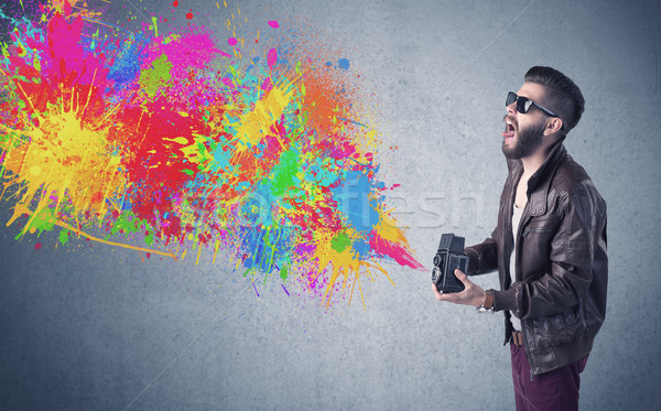 Hipster guy with camera and paint splash Stock photo © ra2studio